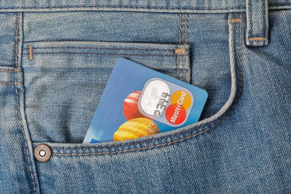 MasterCard credit card in pocket of blue jeans closeup — Stock Photo, Image