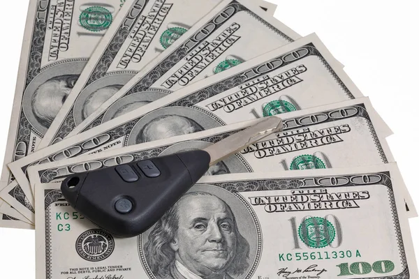 Car keys on one hundred dollar bills background isolated — Stock Photo, Image