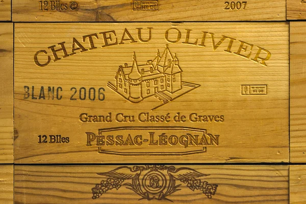 Logo of French winery Chateau Olivier on wooden wine box. — Stock Photo, Image