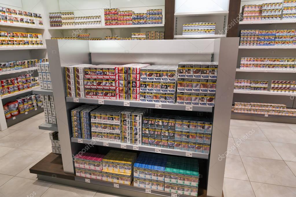 SKOFIJE, SLOVENIA - SEPTEMBER 21, 2017: Tobacco and cigarette store shelf in Travel Free shop. It is a highway retail outlet on the border between Slovenia and Italy.