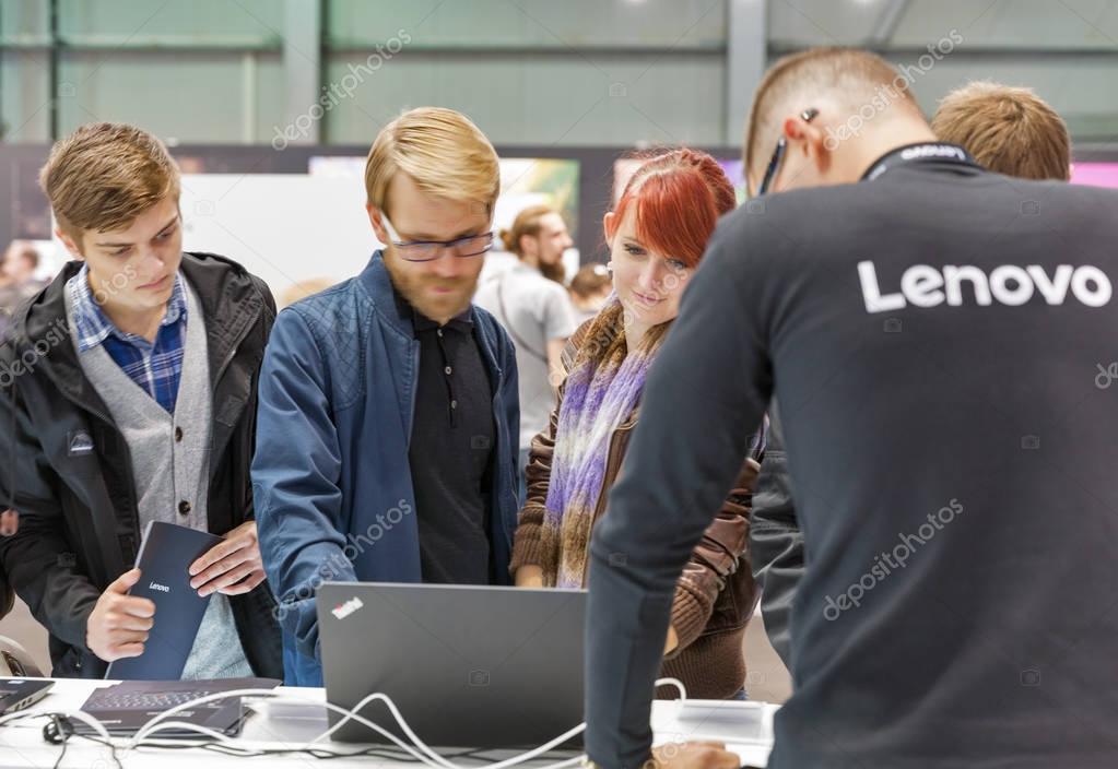 KIEV, UKRAINE - OCTOBER 07, 2017: Unrecognized people visit Lenovo, a Chinese multinational technology company booth during CEE 2017, the largest electronics trade show of Ukraine in KyivExpoPlaza EC.