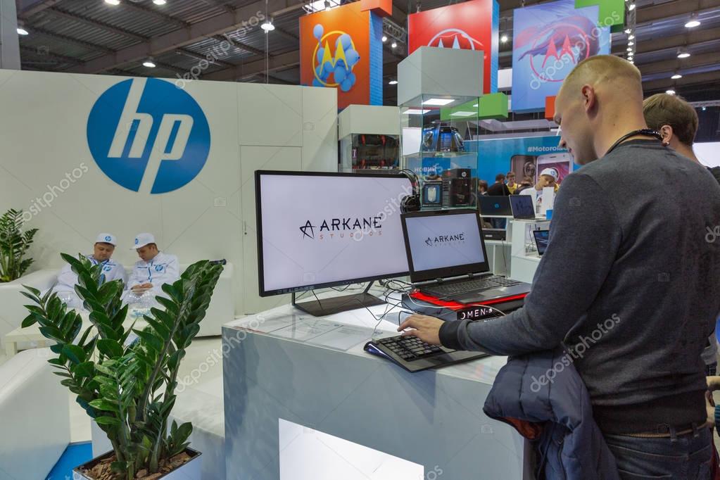 KIEV, UKRAINE - OCTOBER 07, 2017: People visit Hewlett-Packard, American multinational information technology company booth at CEE 2017, largest electronics trade show of Ukraine in KyivExpoPlaza EC.