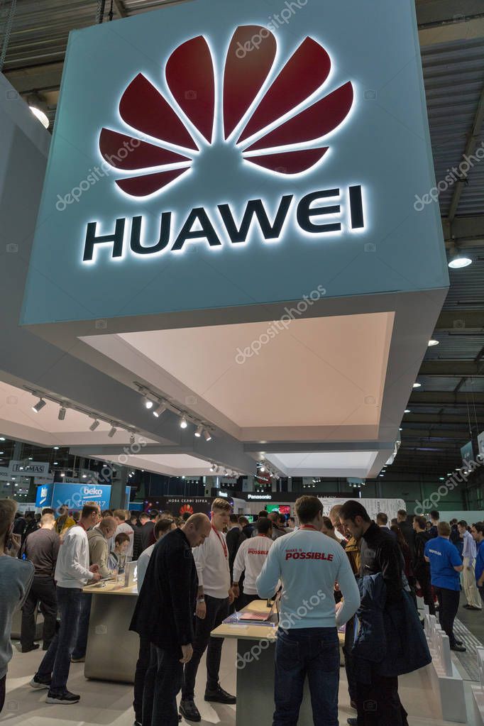 KIEV, UKRAINE - OCTOBER 07, 2017: People visit Huawei, a South Korean multinational corporation booth during CEE 2017, the largest electronics trade show of Ukraine in KyivExpoPlaza EC.