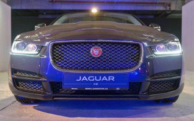 Exhibition with Jaguar XE in Kiev, Ukraine. clipart
