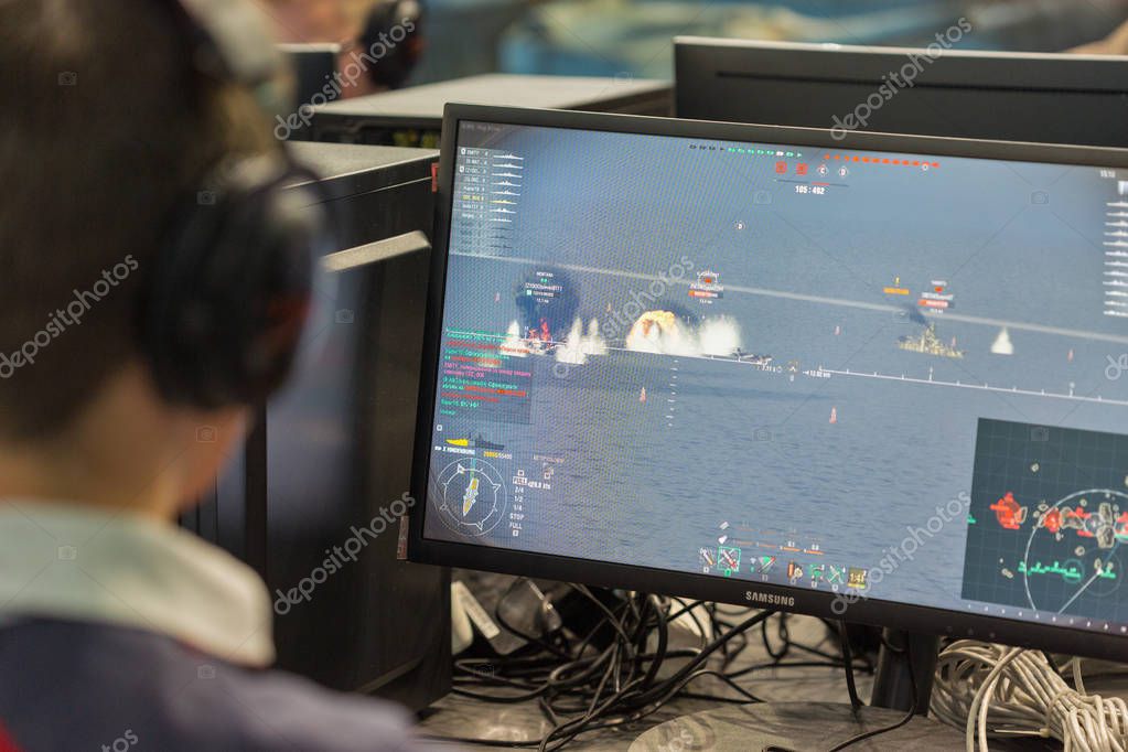 KIEV, UKRAINE - OCTOBER 08, 2017: Unrecognized people visit Wargaming company computer game zone during CEE 2017, the largest consumer electronics trade show of Ukraine in KyivExpoPlaza EC.