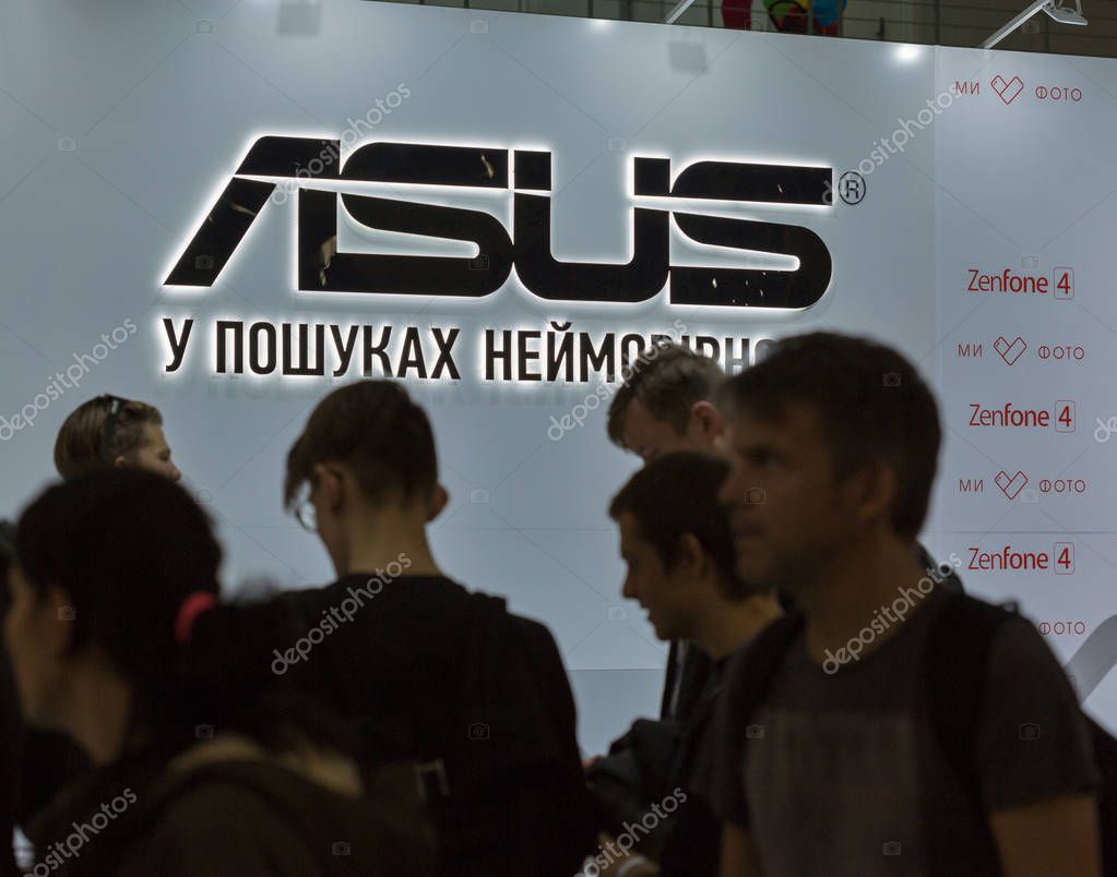 KIEV, UKRAINE - OCTOBER 08, 2017: People visit Asus, a Taiwan based international computer company booth during CEE 2017, the largest electronics trade show of Ukraine in ExpoPlaza Exhibition Center.