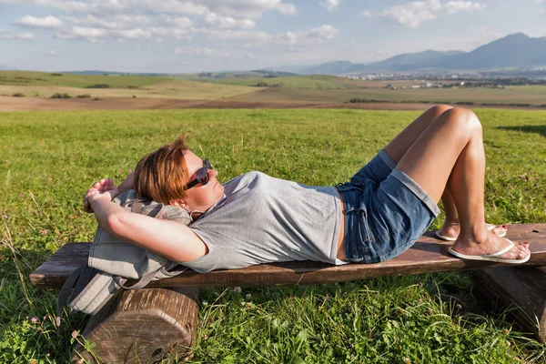 Woman resting on summer hill near Liptovsky Trnovec, Slovakia. — Stock Photo, Image