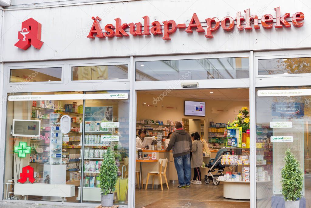 BERLIN, GERMANY - NOVEMBER 18, 2019: People visit Gesundleben Askulap-Apotheke pharmacy in Markisches Trade Center. Berlin is the capital and largest city of Germany by both area and population.