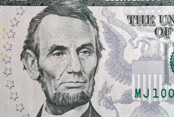 Portrait of US president Lincoln from five dollars bill macro