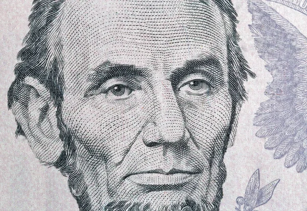 Portrait of US president Lincoln from five dollars bill macro — Stok fotoğraf