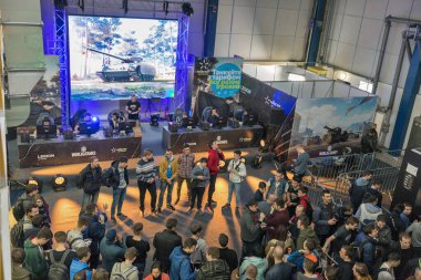 KYIV, UKRAINE - APRIL 13, 2019: Gamers participate in World of Tanks tournament in game zone during CEE 2019, the largest consumer electronics trade show of Ukraine in Tetra Pack EC. View from above.