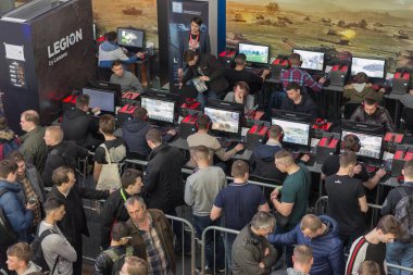KYIV, UKRAINE - APRIL 13, 2019: Gamers stand in queue to participate in the World of Tanks tournament in game zone during CEE 2019, largest consumer electronics trade show of Ukraine in Tetra Pack EC.