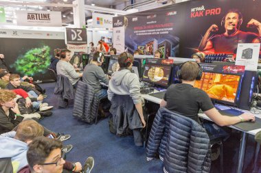 KYIV, UKRAINE - APRIL 13, 2019: Gamers participate in World of Tanks tournament in game zone during CEE 2019, the largest consumer electronics trade show of Ukraine in Tetra Pack EC.