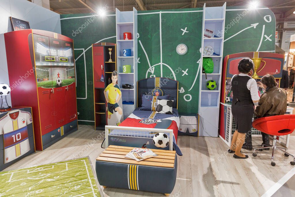 KYIV, UKRAINE - MARCH 11, 2016: People visit Cilek children's rooms Turkish furniture company booth at KiFF exhibition in ExpoPlaza EC.