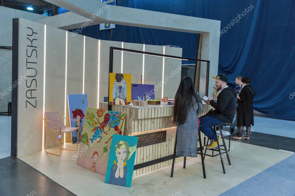 KYIV, UKRAINE - MARCH 11, 2016: People visit Zasutsky Architects booth at KiFF furniture exhibition, annual international forum of producers and suppliers of furnitures in ExpoPlaza EC.