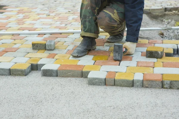 Laying Paving Slabs by mosaic close-up. Road Paving, constructio