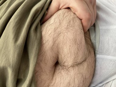 Funny fat man showing his big hairy belly.