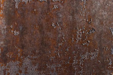 Boyanın soyulduğu metal levha, zamanın ve havanın etkilerinden dolayı aşınma sürecinden geçiyor. Eski endüstriyel doku