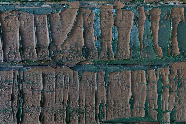 Hava ve zamanın etkisiyle soyulan ahşap panelin bir parçası. Bir kentsel dokunun parçası