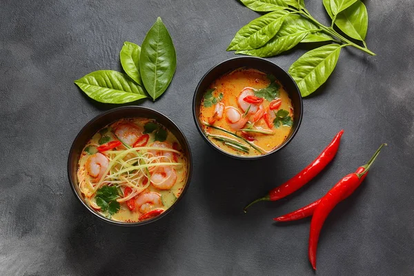 Laksa Soup  a Malaysian Coconut Curry Soup with shrimps over rice noodles topped with fresh bean spouts,cucumber, lime, red chili pepper and cilantro