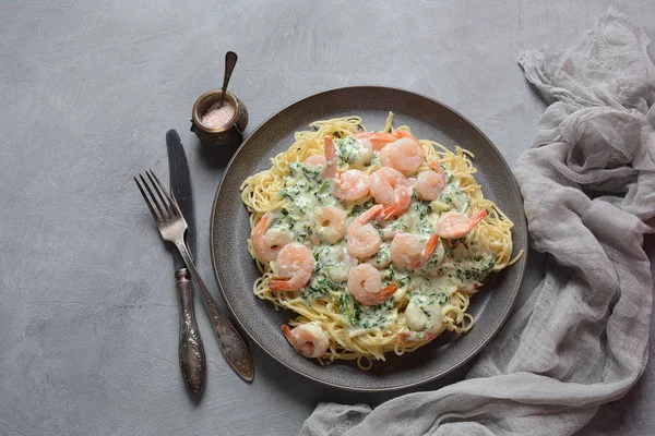 Italian Spaghetti or Pasta with shrimps, garlic and herbs in a creamy Alfredo sauce. Keto diet food concept