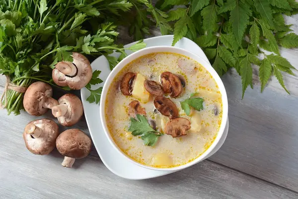 Delicious soup with mushrooms champignon and potato.Creamy Chanterelle Soup .Nordic cuisine. Vegan soup — Stock Image Delicious Soup Mushrooms Champignon Potato Creamy Chanterelle Soup Nordic Cuisine Royalty Free Stock Images