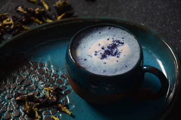 Healthy Blue Butterfly Pea Latte Tea from flowers Clitoria ternatea plant or Asian pigeon wings . Detox, antioxidant, anti-stress, anti- ageing beverage