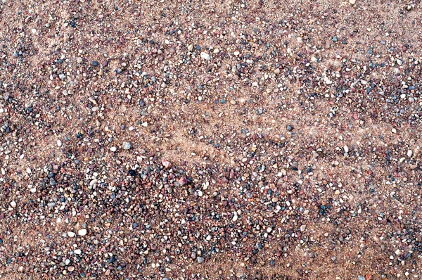 Detalhe da textura da superfície com pequena pedra de seixo no chão sujo — Fotografia de Stock