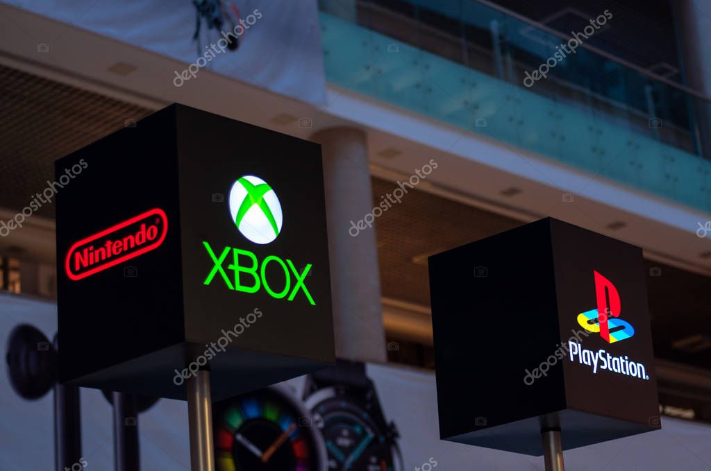 Minsk, Belarus - november 1, 2019 : Logo of xbox, playstation and nintendo on cubic black signs in the mall. concept of large gaming companies, selling games and game consoles