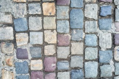 colorful paving slabs extending in the street.