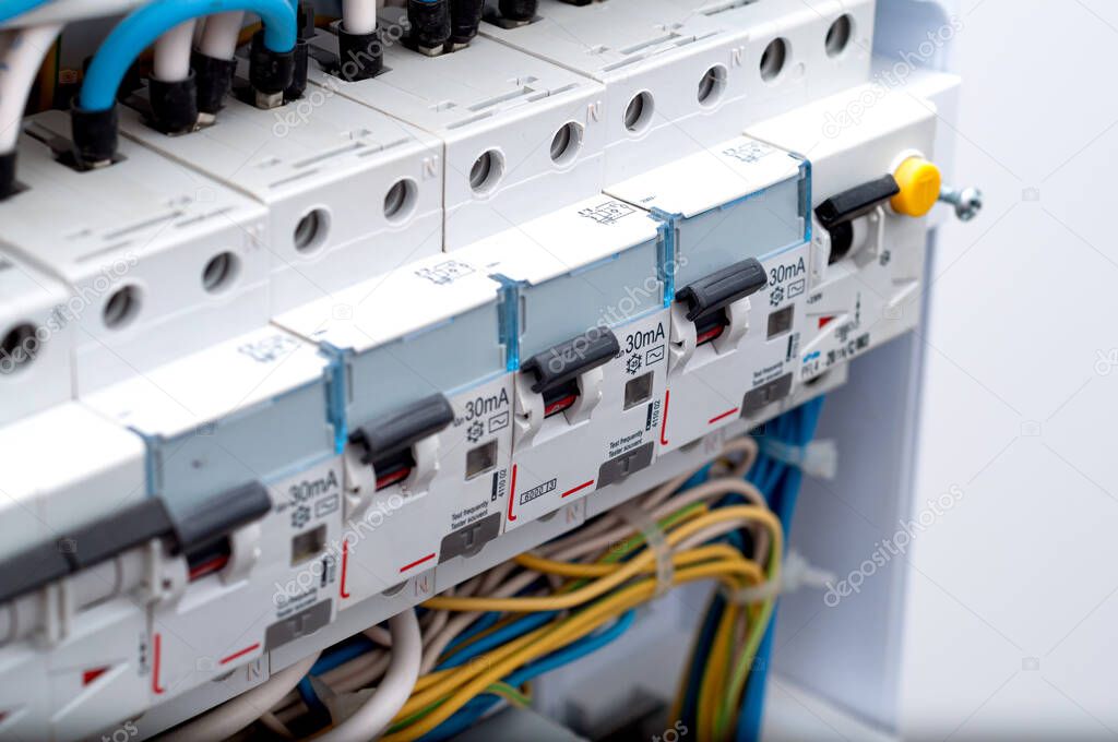 Voltage switchboard with circuit breakers. Electrical background close up