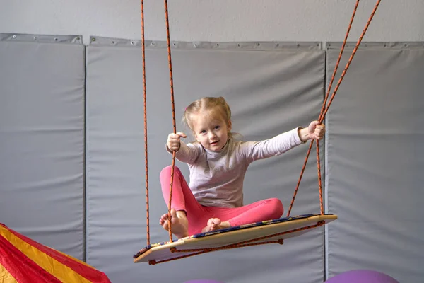 Girl in tape made of elastic material. sensory experience, enhance tactile and sensitivity — Stock Photo, Image