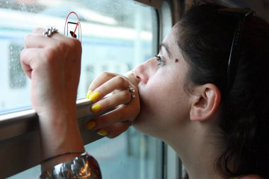 young woman traveling on a regional train