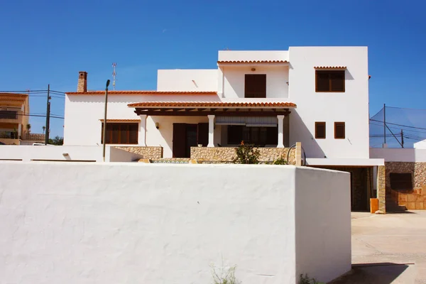 holiday home for tourists in the balearics under construction typical cubic square villa of ibiza and formentera in the middle of dry nature in spain