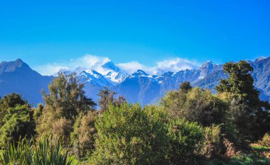 View of Southern Alps from Lake Matheson, South Island, New Zealand clipart