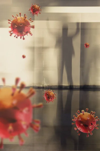 Bayangan seseorang berdiri melawan dinding corona virus rendering di sebuah bangunan dengan dinding beton — Stok Foto