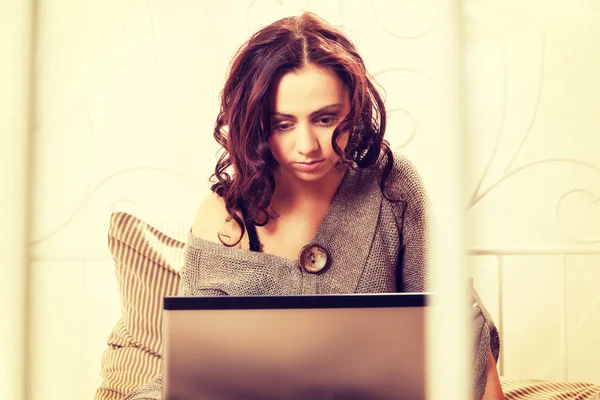 Pretty woman using her laptop — Stock Photo, Image