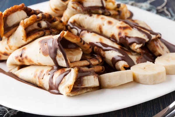 Crepes with banana and chocolate cream — Stock Photo, Image