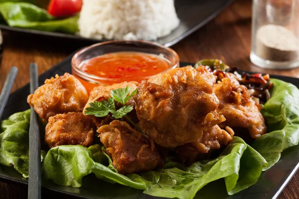 Fried chicken pieces in batter — Stock Photo, Image