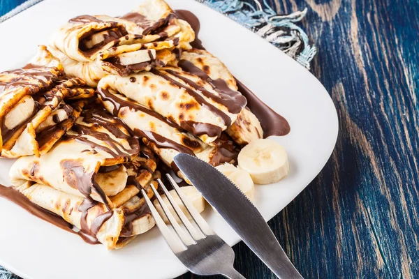 Crepes with banana and chocolate cream — Stock Photo, Image