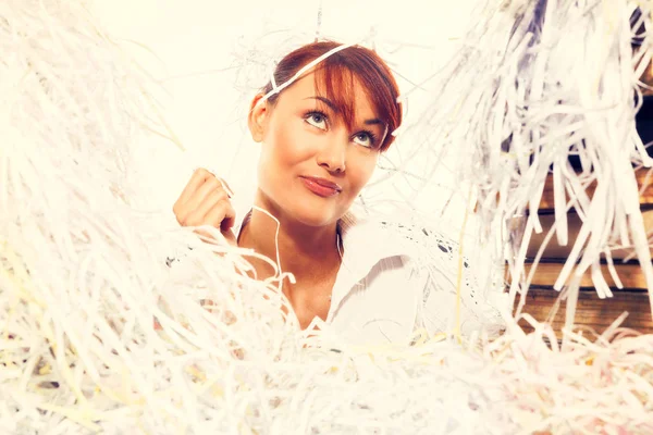 Ecology concept. Young woman with shredded paper. Focus on face — Stock Photo, Image