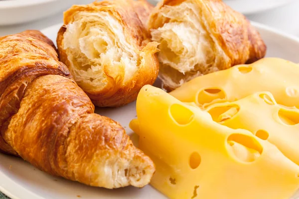 Croissants with cheese, fruits and coffee — Stock Photo, Image