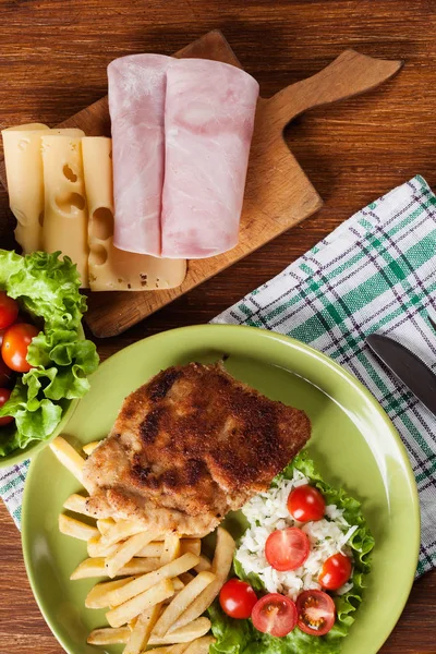 Cutlet Cordon Bleu with pork loin served with French fries and s — Stock Photo, Image