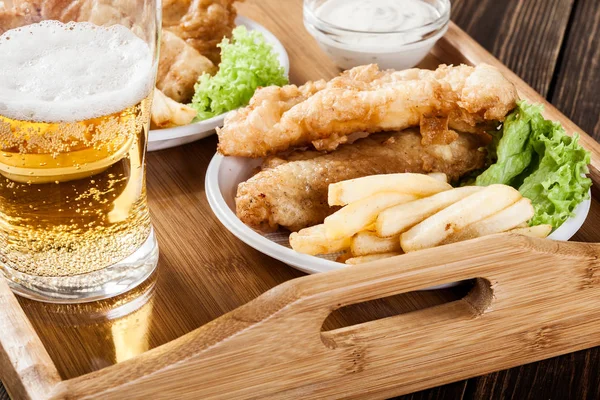 Fish and chips with tartar sauce on a tray — Stock Photo, Image