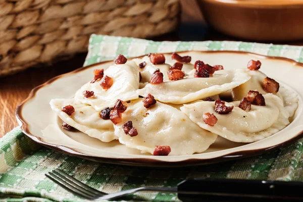 Dumplings with meat or cabbage and mushroom or cheese seasoned fried bacon — Stock Photo, Image