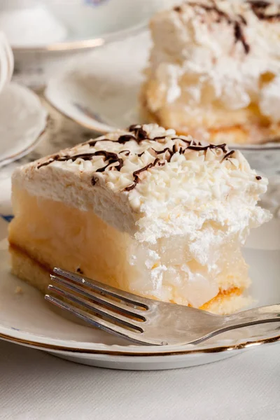 Fresh sweet apple cake with whipped cream served with cup of tea — Stock Photo, Image