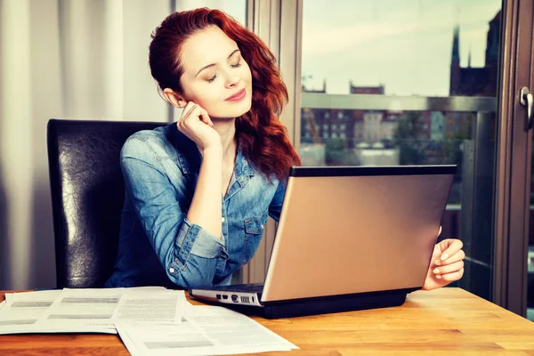 Red-haired young business woman or student girl working with doc — Stock Photo, Image