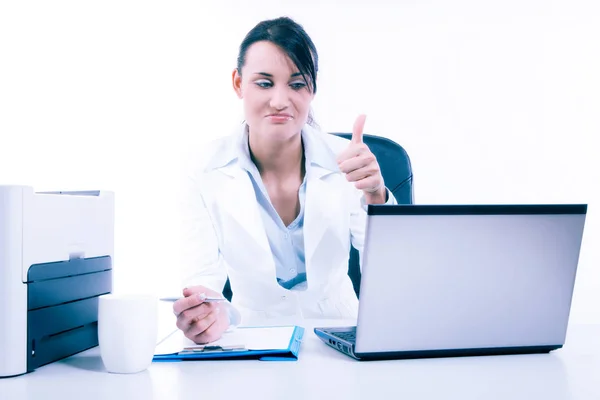 Young attractive business woman using laptop at the office — Stock Photo, Image
