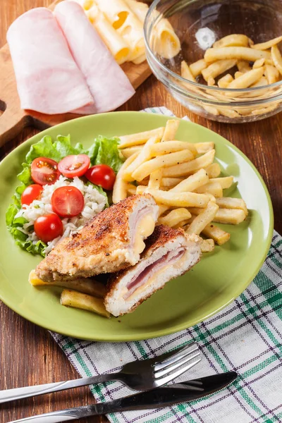 Cutlet Cordon Bleu with pork loin served with French fries and s — Stock Photo, Image