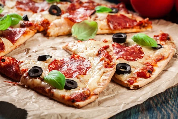 Slices of pizza pepperoni with olives — Stock Photo, Image